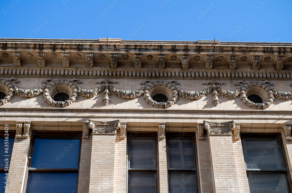 Victorian Building Facade with Grunge and Dirt Under Blue Sky. Victorian Building Facade with Grunge and Dirt Under Blue Sky.