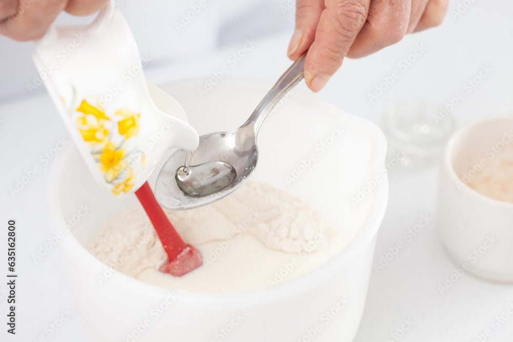 Home made pizza dough preparation. Adding oil. Pizza preparation. Home made pizza dough preparation. Adding oil. Pizza preparation.