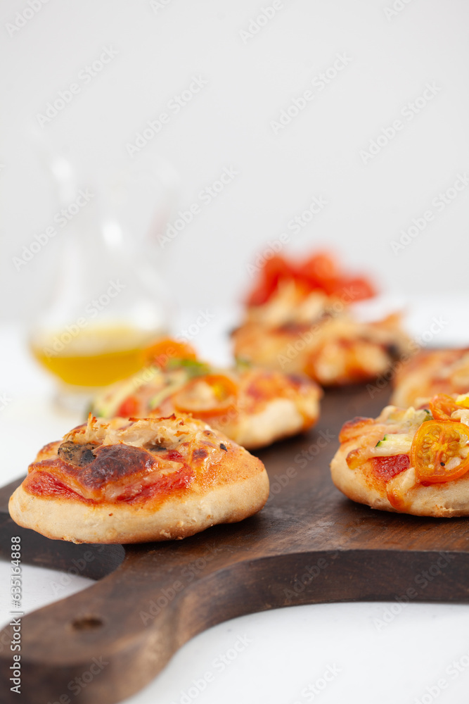 Delicious just baked homemade mini pizzas. Delicious just baked homemade mini pizzas.