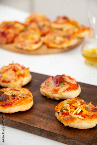 Delicious just baked homemade mini pizzas. Vegetarian pizza.