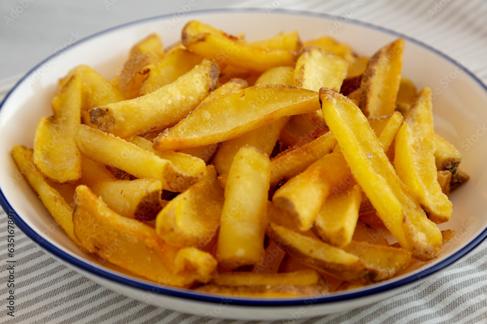 Homemade French Fries on a Plate, side view. Close-up. Homemade French Fries on a Plate, side view. Close-up.