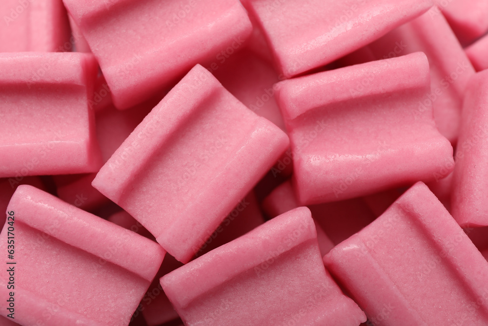 Tasty pink chewing gums as background, top view Tasty pink chewing gums as background, top view