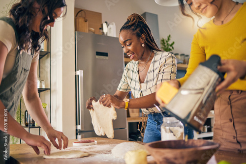 Cooking, friends and food with women in kitchen for pizza, support and nutrition. Happy, bonding and help with group of people and preparing lunch at home for conversation, diversity and health