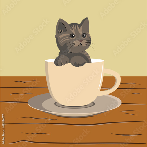 A small kitten sits in a tea cup.