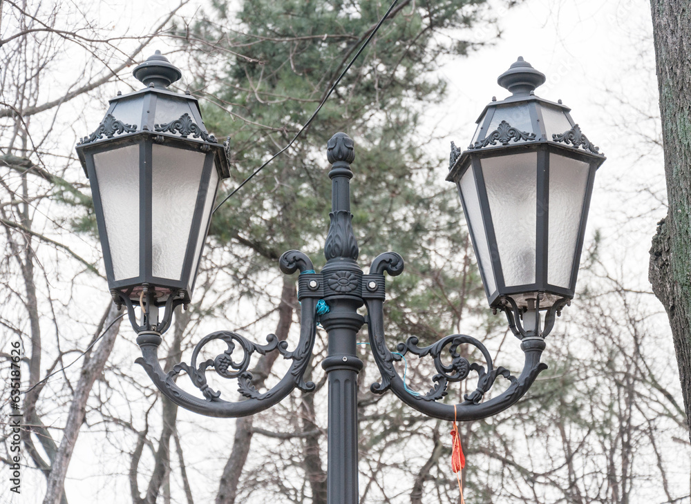A street lamp that illuminates a part of the old town.