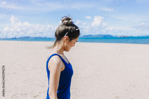 Portrait of asian woman feeling hot and burn from the sun on sunny beach.