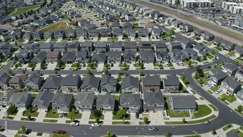 Soaring over densely packed residential neighborhood with houses close together