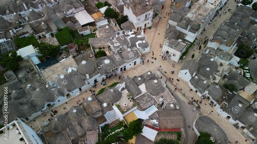 Aerial view of the famous village in Italy Alberobello: conical roofs, trulli houses, amazing architecture photo