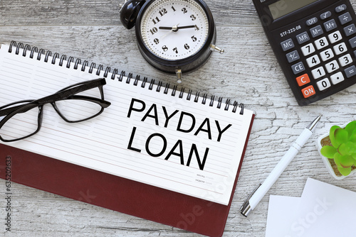 Wallpaper Mural PAYDAY LOANS. Business concept top view of diary and desk clock. text on paper Torontodigital.ca