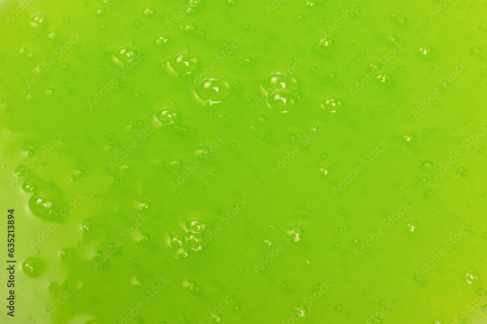 Green slime toy as a background.