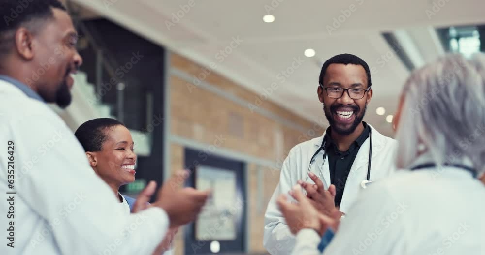 Healthcare, high five and applause with a team of doctors in the hospital for success or support in medicine. Goals, target and motivation with a professional medical group in a clinic for health Healthcare, high five and applause with a team of doctors in the hospital for success or support in medicine. Goals, target and motivation with a professional medical group in a clinic for health