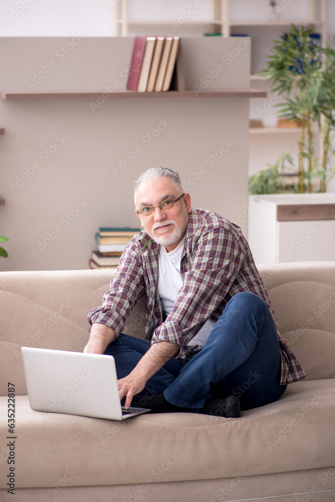 Old man working from home during pandemic Old man working from home during pandemic