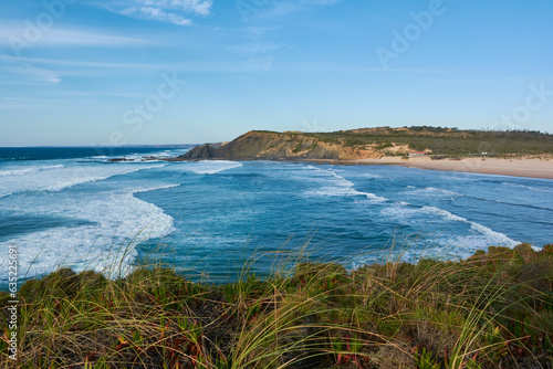 Typical western Algarvian landscape. Stormy ocean and lonely beach. Portugal