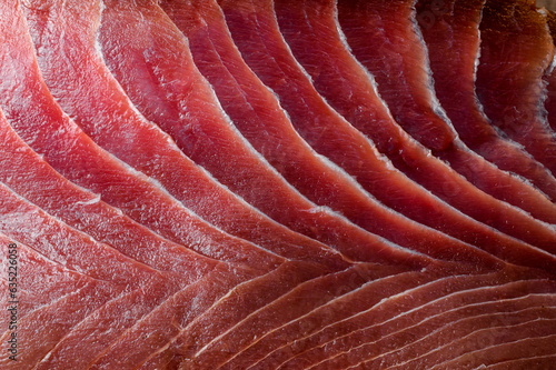 Appetizing fresh sliced bluefin tuna raw meat texture. Close-up. Macro photo