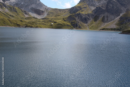 Beautiful view of Lake Lunersee surrounded by Alps in Vorarlberg, Austria