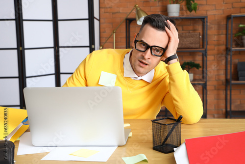Stressed businessman workin...