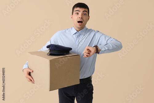 Shocked young postman with ...