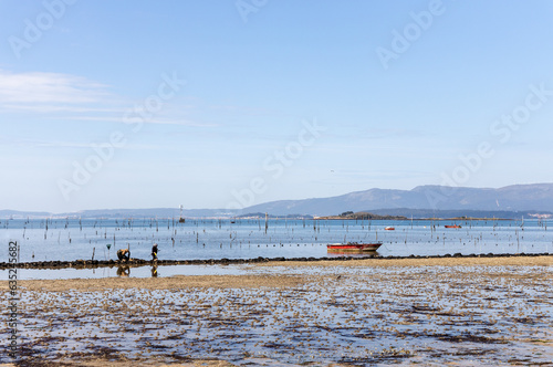 Two persons are fishing in the coast