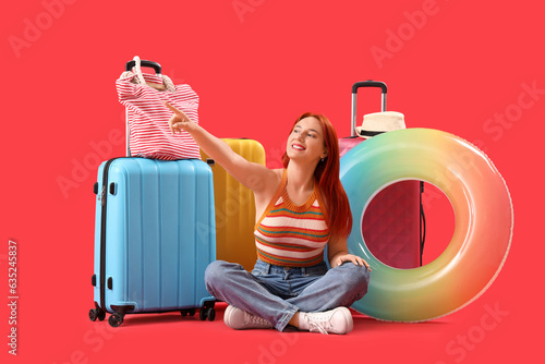 Happy female tourist with l...