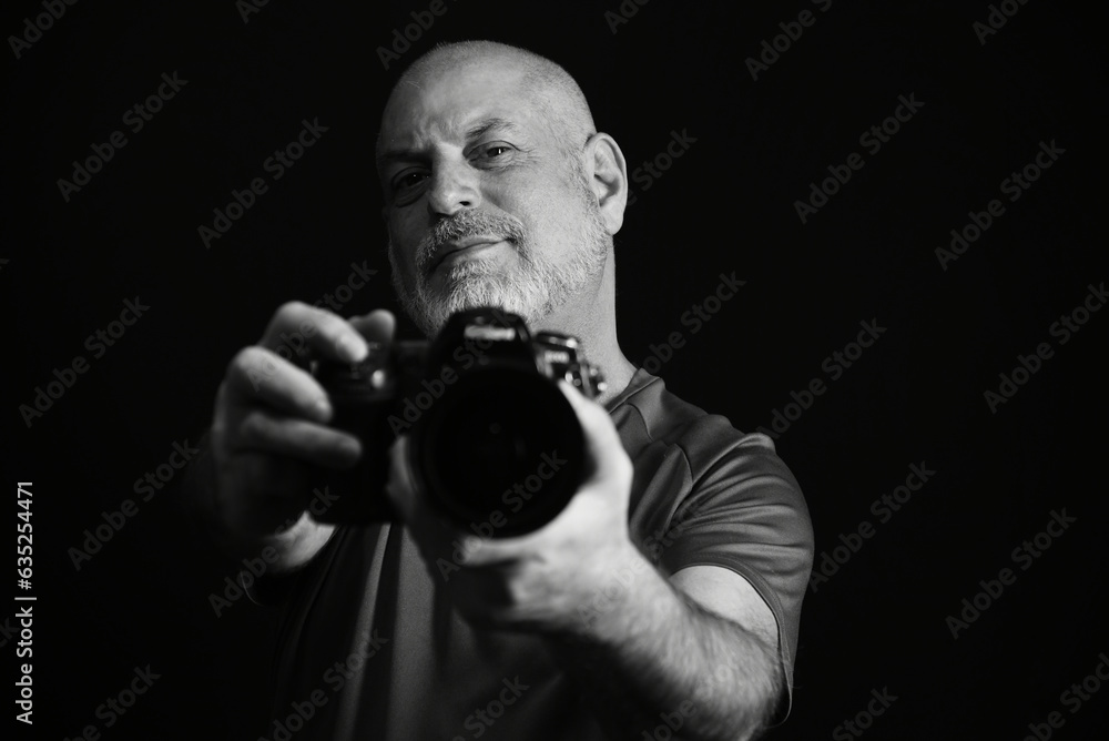 photographer portrait of man holding photo camera record of images photographer portrait of man holding photo camera record of images