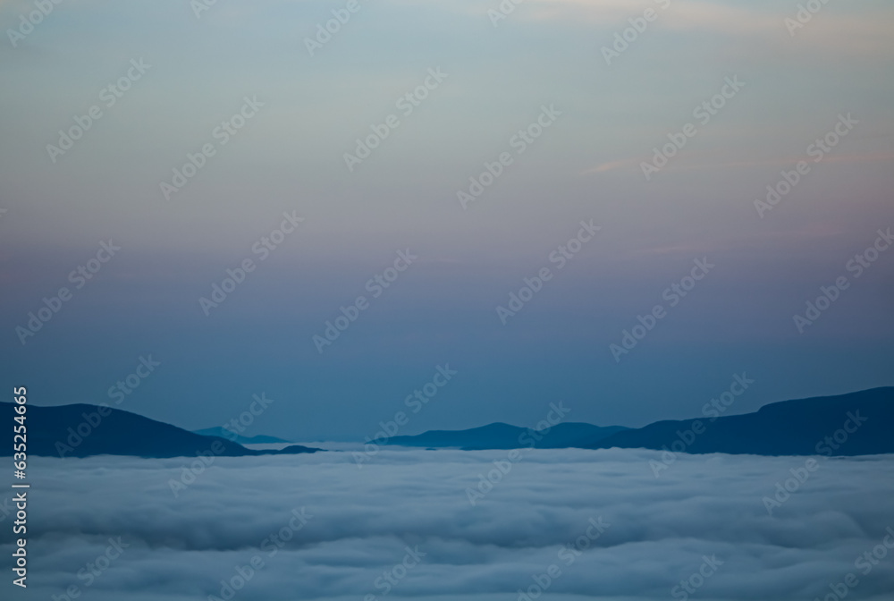 Landscape of mountains under the clouds.