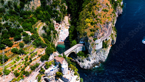 Aerial drone view of Fjord of Furore. The azure waters, cliffs and famous bridge in Amalfi coast, Italy 
