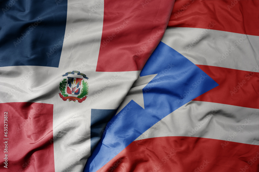 Fototapeta premium big waving realistic national colorful flag of cuba and national flag of puerto rico .