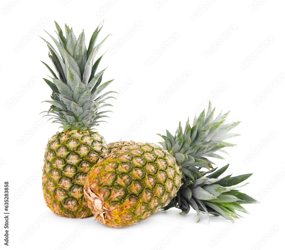 Two delicious ripe pineapples isolated on white Two delicious ripe pineapples isolated on white