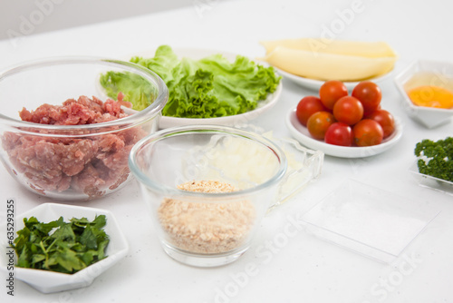 Ingredients for burger. Step by step preparation of mini burgers. Homemade mini burgers for children or appetizers. Small hamburgers.