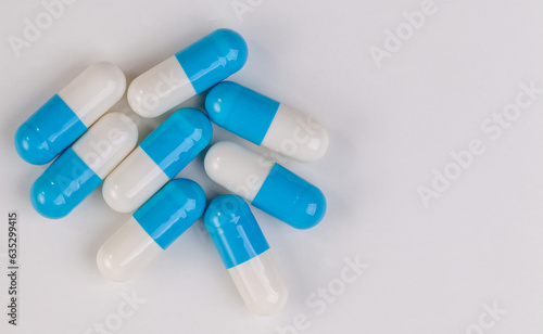 Colorful pill capsule on white background.