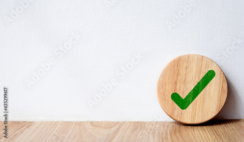A circular plank with a green checkmark icon. checkmark, checkmark, tick icon, checkmark, green circle checkmark button, done. On white background. Banner. Copy space.