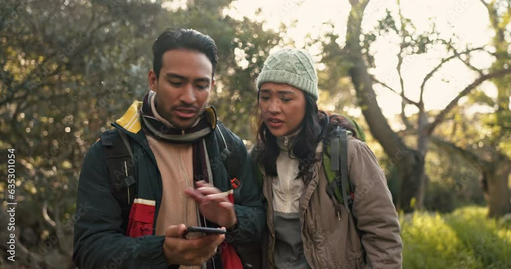 Couple, hiking and lost, smartphone and map online with disagreement, mistake and search location on app. People in woods, trekking and navigation fail, nature and technology with doubt and confused Couple, hiking and lost, smartphone and map online with disagreement, mistake and search location on app. People in woods, trekking and navigation fail, nature and technology with doubt and confused