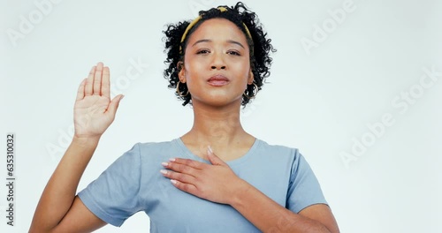 Palm, chest and hand by woman face in studio for swear, honesty and vow against white background. Portrait, emoji and female model with pledge sign for military, army or soldier, respect or salute photo