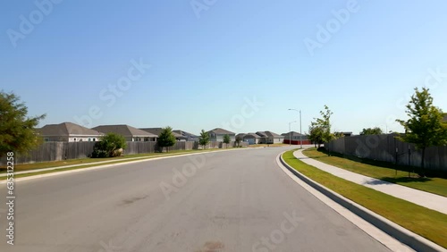 Aerial video residential neighborhood in Shadowglen.Manor Texas photo