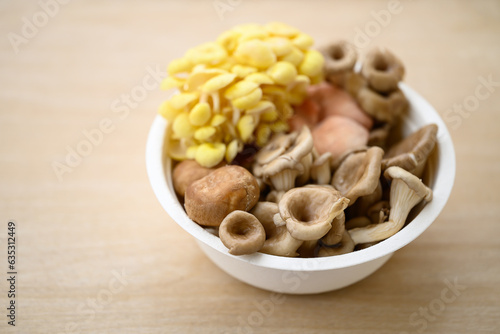 Various edible mushroom in biodegradable bowl, Organic ingredient food