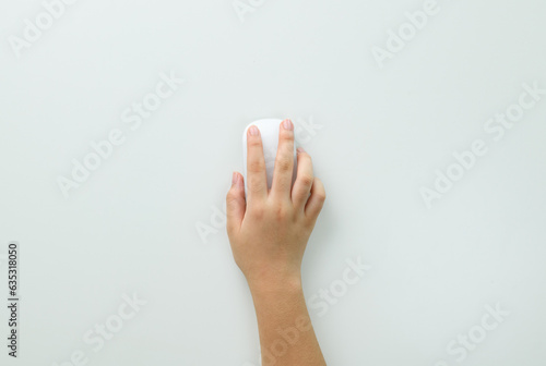 Wallpaper Mural Hand of woman using modern wired optical mouse bluetooth searching online isolated on white background, flat lay, top view. Space for text. Digital network technology concept. Torontodigital.ca