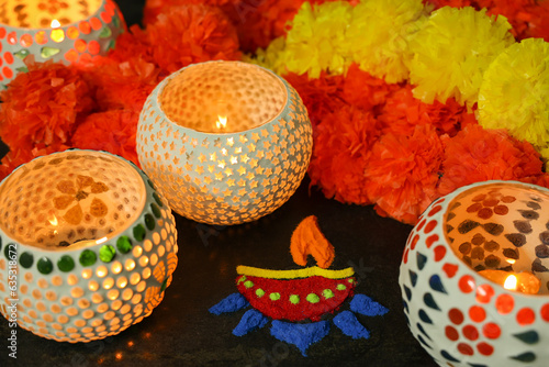 Diwali celebration Indian festival of lights Diya oil lamp lantern. Colors Rangoli decoration colorful flowers flowerbed copy space. Greetings Deepavali Hindu festival North India Mumbai Delhi India. photo