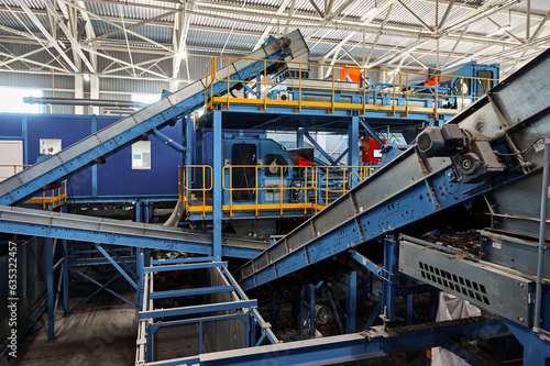 Conveyors carry trash and empty platforms at recycling plant © nordroden