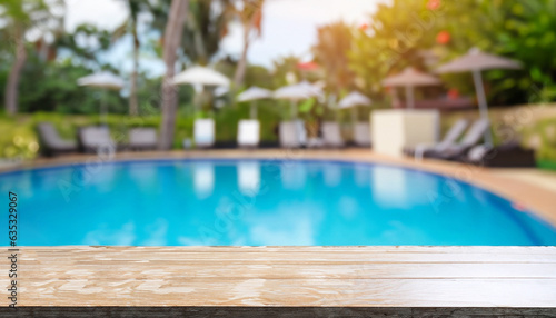 Empty table top and blurred swimming pool in tropical resort in summer for display or montage your products. © Uuganbayar