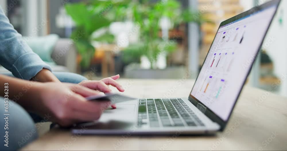 Person, laptop and hands with credit card in ecommerce, payment or banking on desk at home. Closeup of shopper with debit or typing bank details on technology or website in online shopping on table