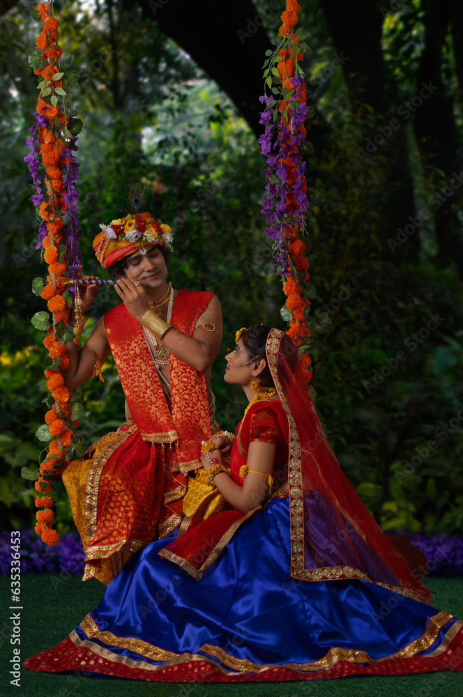 Young man and woman dressed up as Radha and Krishna and performing on the occasion of Janmashtami Young man and woman dressed up as Radha and Krishna and performing on the occasion of Janmashtami