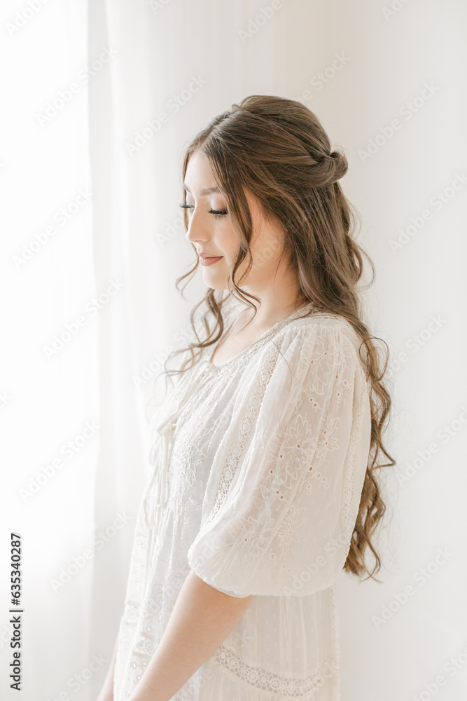 ethereal hispanic woman in bridal dress with hair and makeup done ethereal hispanic woman in bridal dress with hair and makeup done