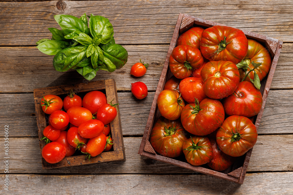Assorted tomatoes in rustic crate Assorted tomatoes in rustic crate
