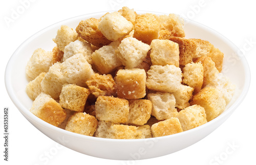 Crispy croutons in bowl isolated