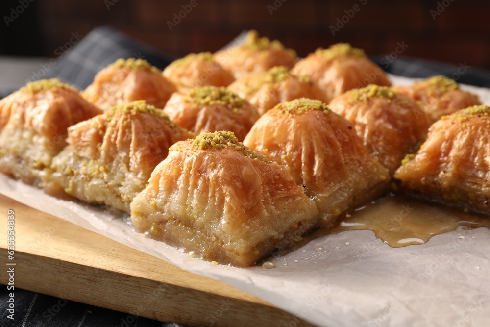 Delicious sweet baklava with pistachios on table, closeup Delicious sweet baklava with pistachios on table, closeup