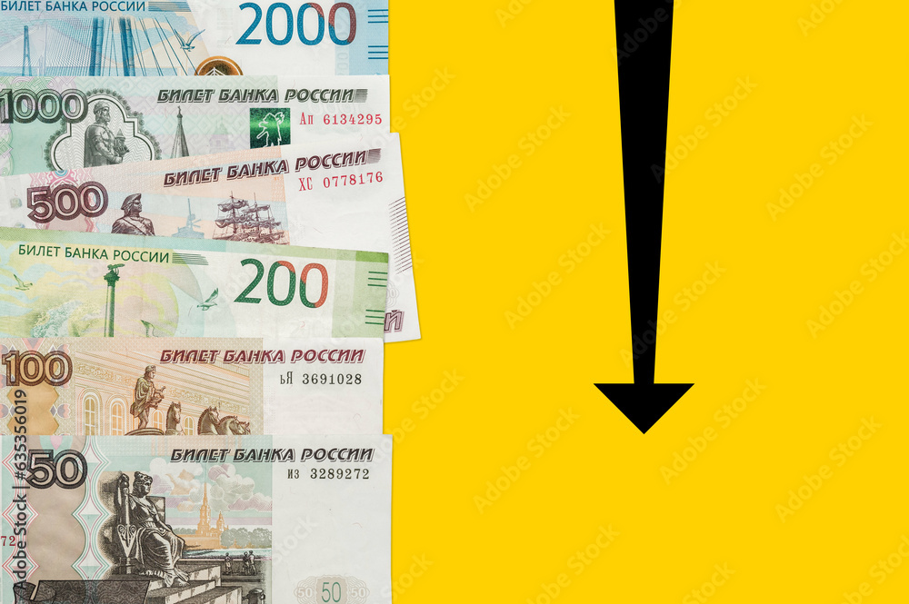 Russian rubles on a yellow background. Fall of Russian Rouble. Roubles is the currency of the Russian Federation.