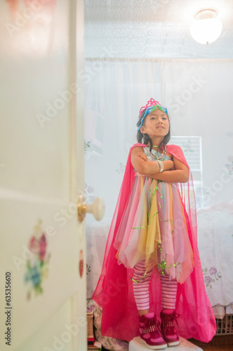 Vietnamese  American 7 year girl showinging off her  favorite outfits photo