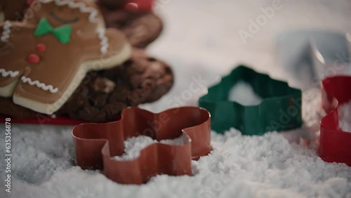 Pan Across Cookie Cutters and GingerBread Men in a Winter Wonderland. photo