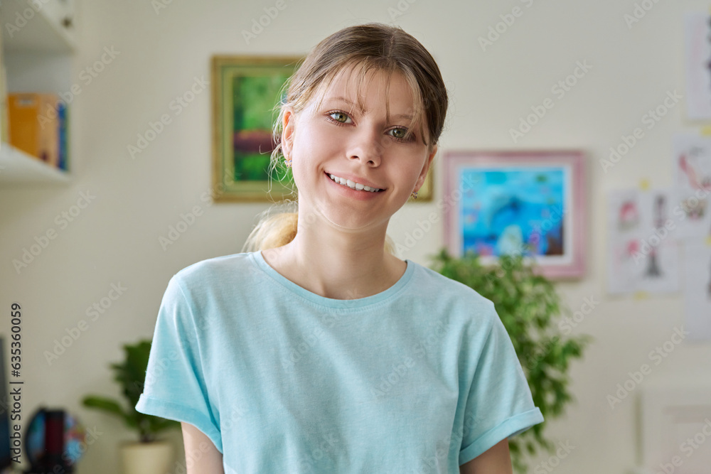 Close up portrait of preteen girl looking at camera inside room Close up portrait of preteen girl looking at camera inside room