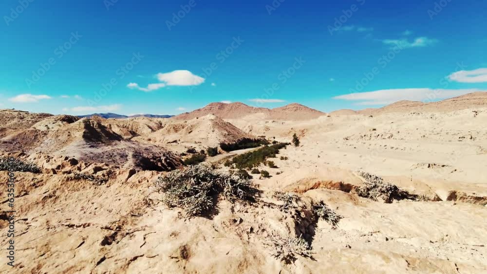 a canyon with a river between mountains and palm trees a canyon with a river between mountains and palm trees